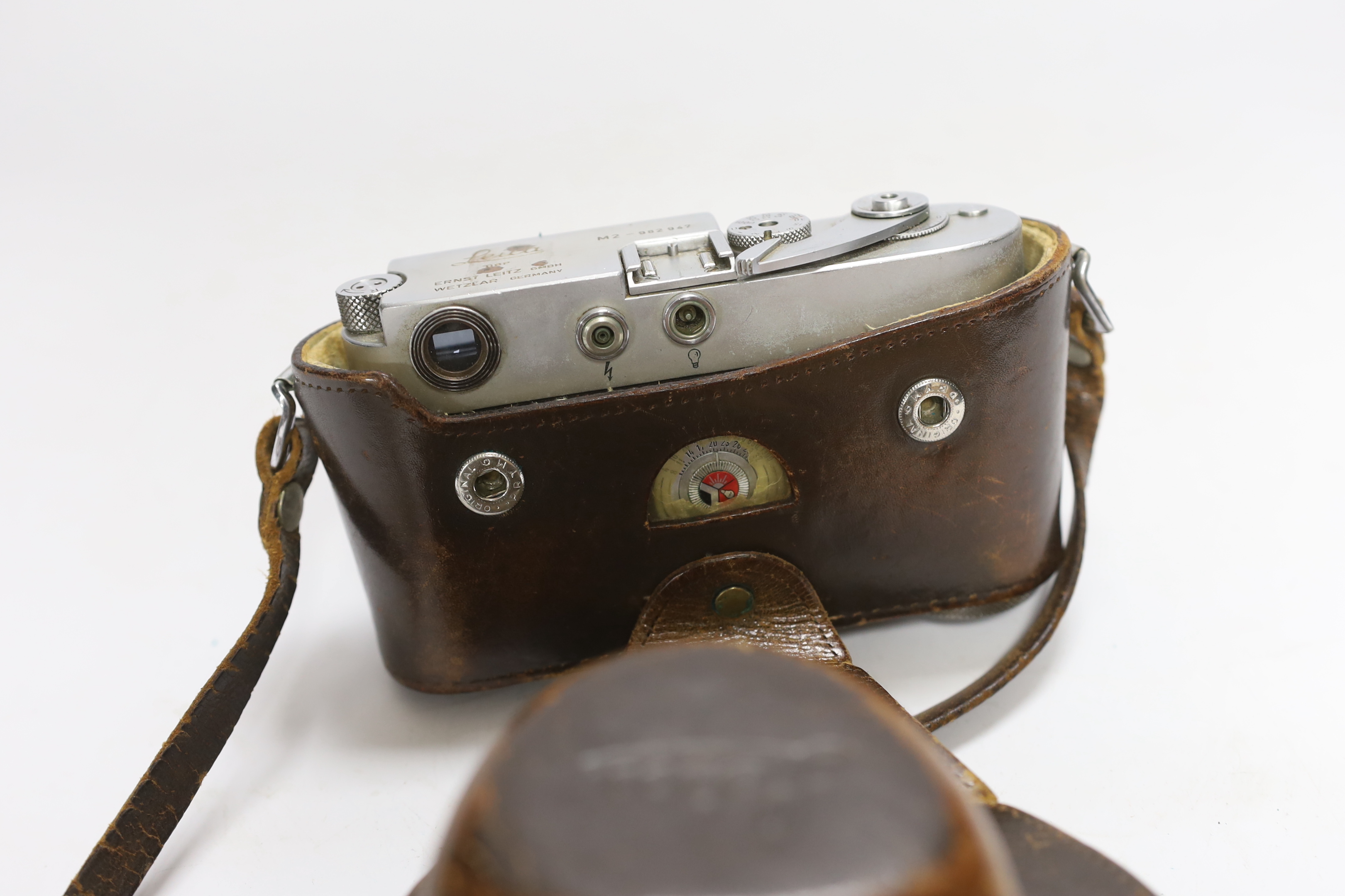 A Leica M2 camera, serial no. 982947, c. 1959, with Summilux 1:1. 4/50 lens, in leather case with strap